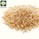 Close-up of Nature's Glory organic fragrant long-grain brown rice, showing uncooked golden-brown grains.